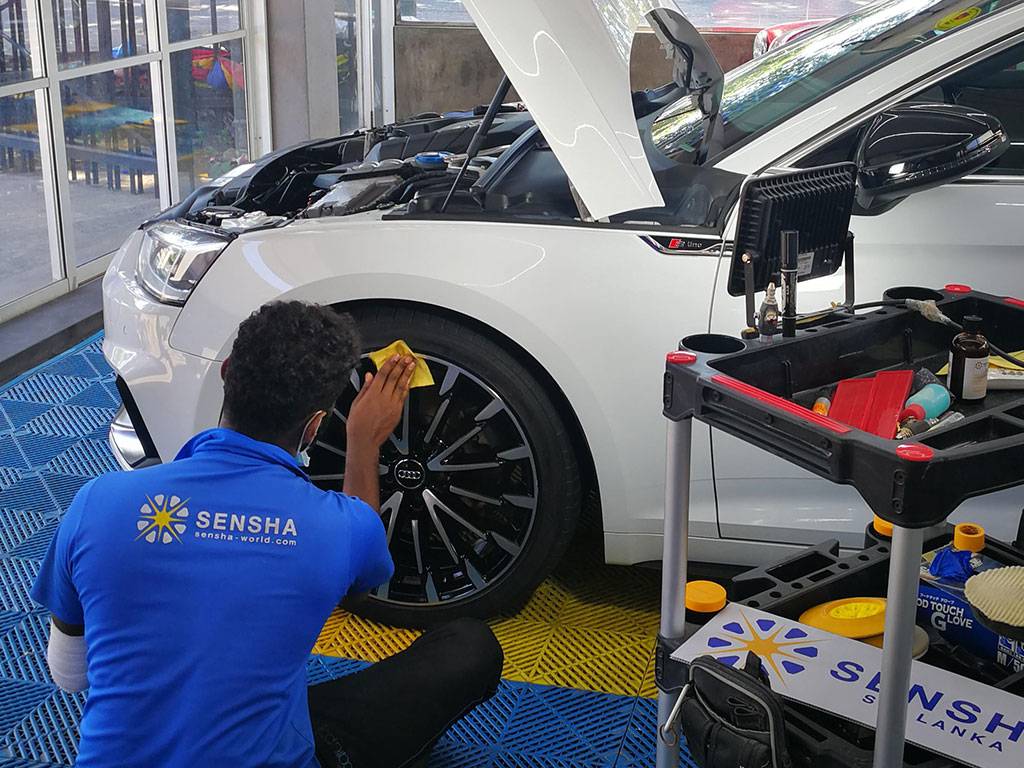 Detailing technician applying SENSHA Wheel Coating for ultimate tyre protection