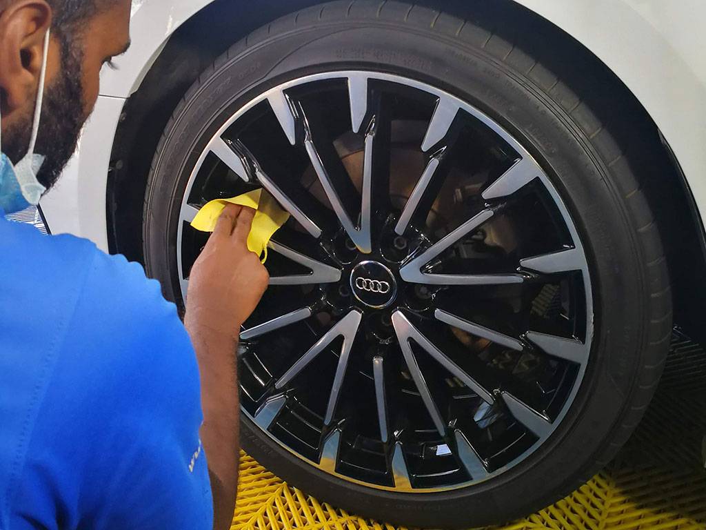 Detailing technician applying SENSHA Wheel Coating for ultimate tyre protection