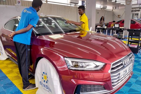 SENSHA Crystal coating being applied to a red Audi at Taiyo CarePoint